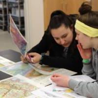 Students working on maps